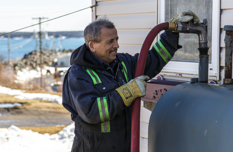 Mercer Fuels heating oil delivery filling residential oil tank in Cape Breton NS